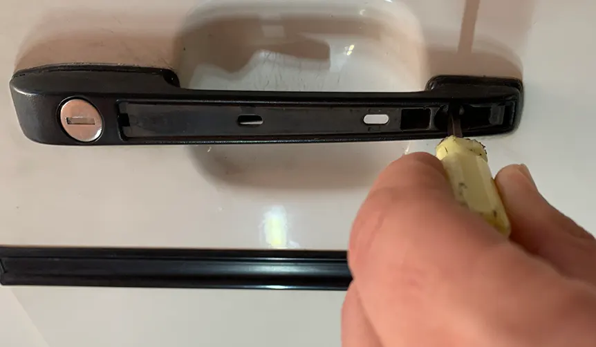 Remove door handle first screw